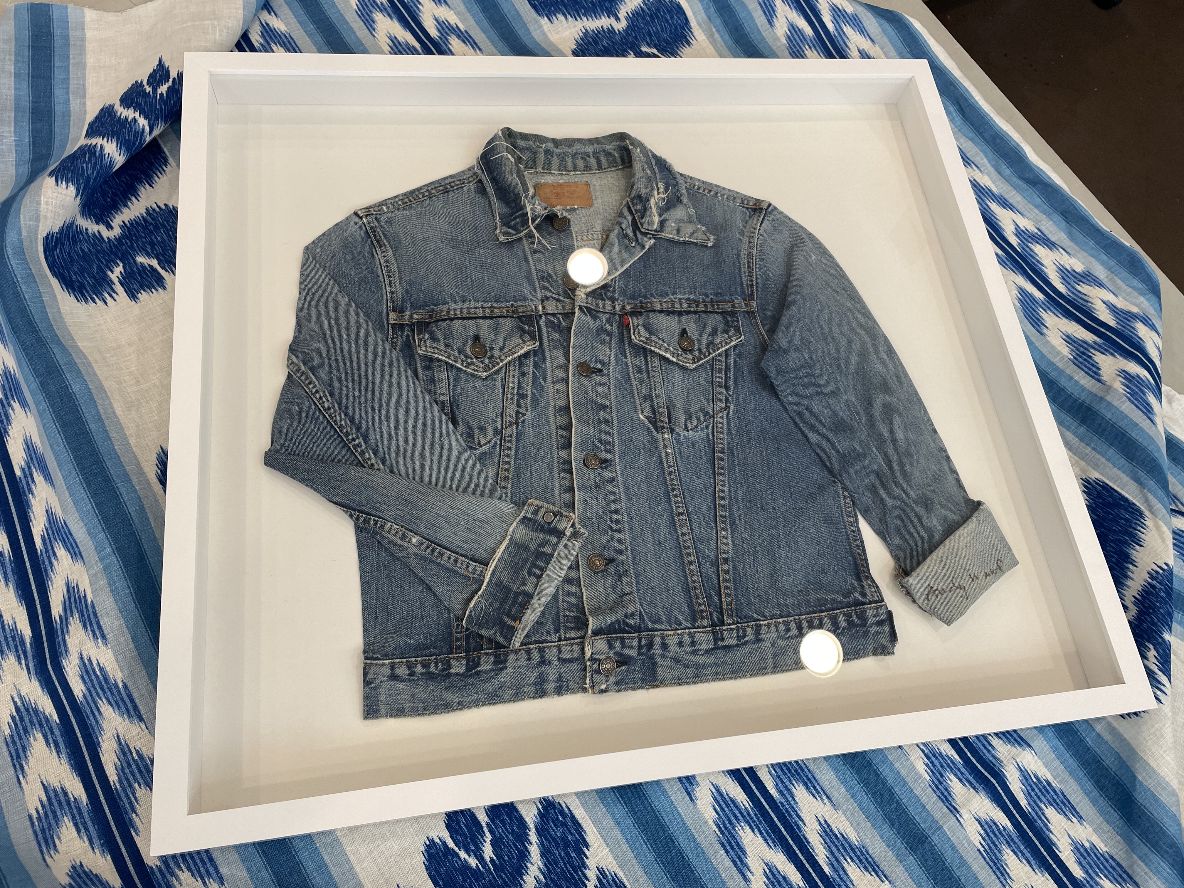a jacket in white shadowbox 